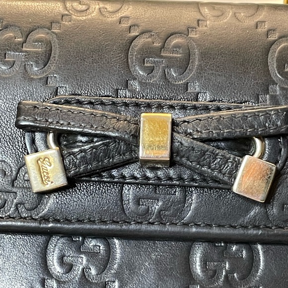 Gucci black leather Guccisimo trifold wallet with blk leather & gold tipped bow - Picture 12 of 15